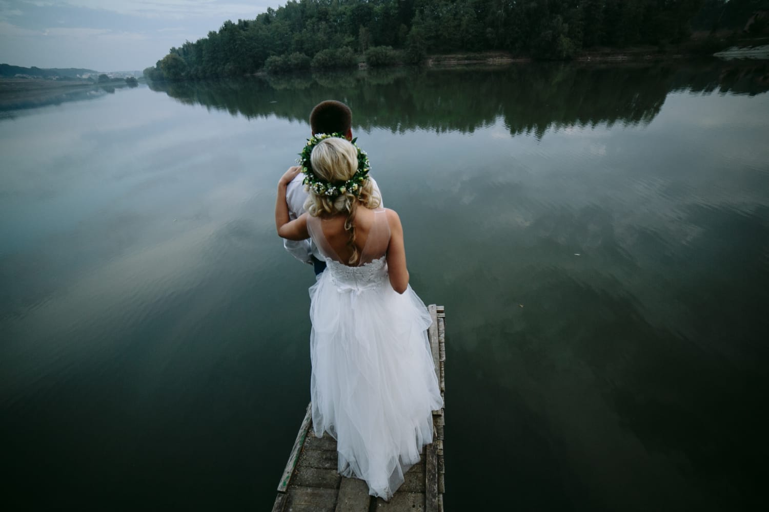 bride-with-her-husband-front-looking-lake